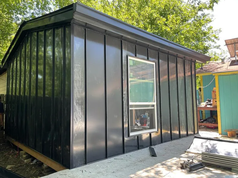 Black standing seam metal wall panels for Roof Inspection in River Falls