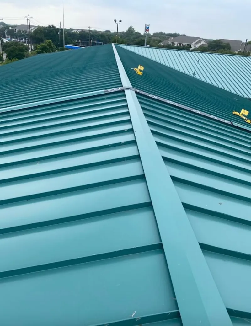 Green commercial metal roof ridge and valley for Metal Roof Repair in River Falls