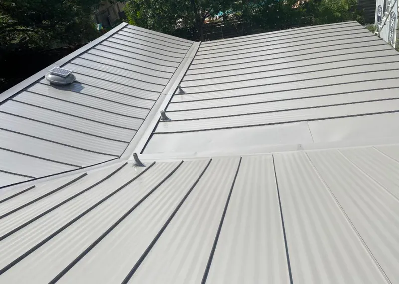 Solar attic fan installed on a metal roof for Roof Ventilation in River Falls